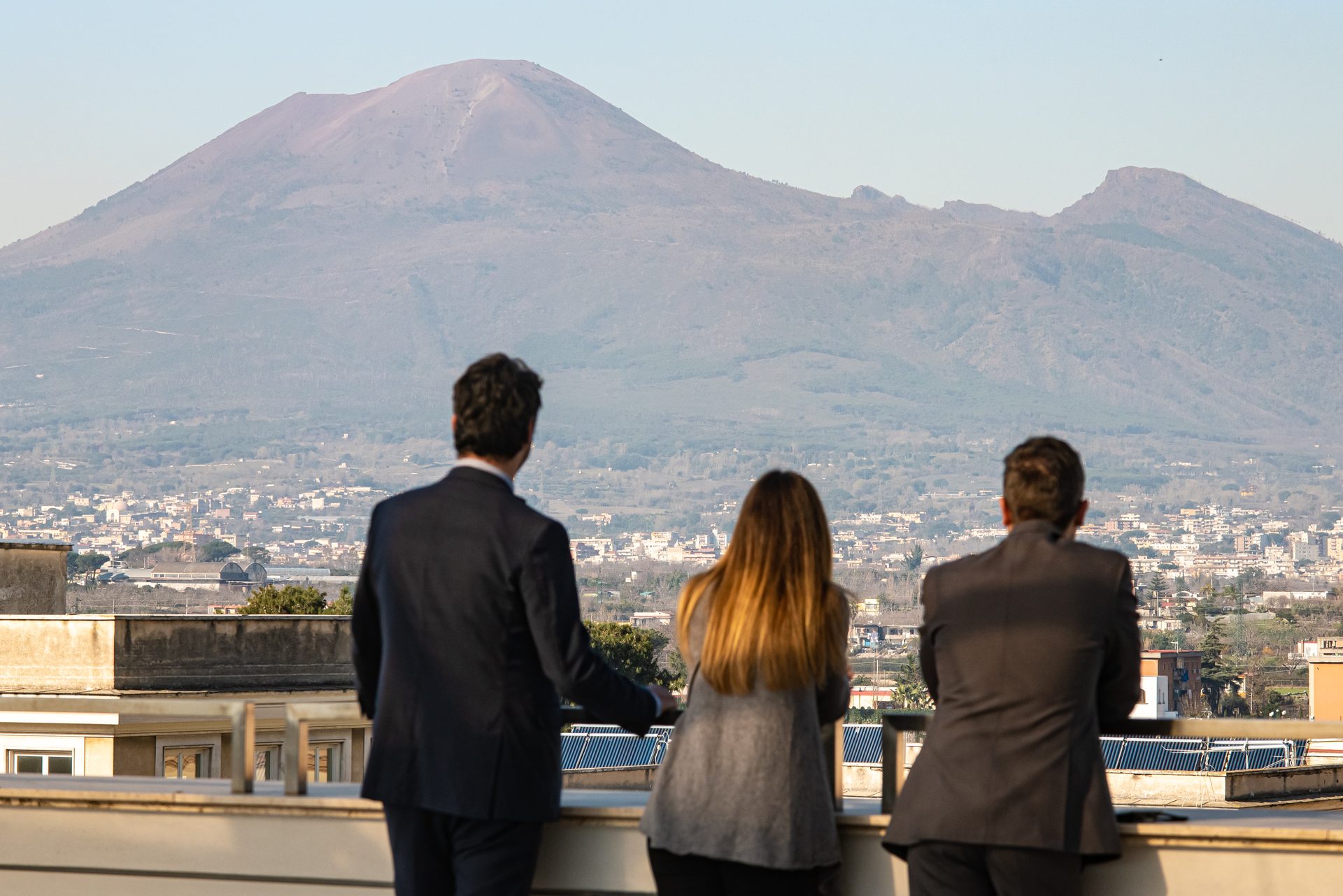 The rooftop terrace at Habita79 facing Vesuvius at sunset
